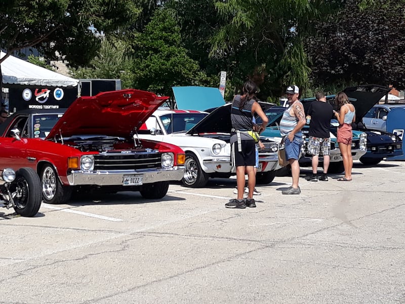 People check out the classic cars Saturday, July 31, 2021, at the 37th annual La Salle County Cruisers car show in downtown Ottawa.
