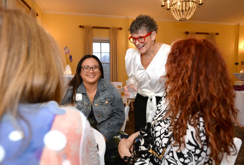Former Bethel Learning Center teacher Georgia DeClark (center right) talks to friends during a retirement and gala held in her honor on Thursday, April 24, 2025 at Wilder Mansion in Elmhurst. Georgia taught for 30 years.