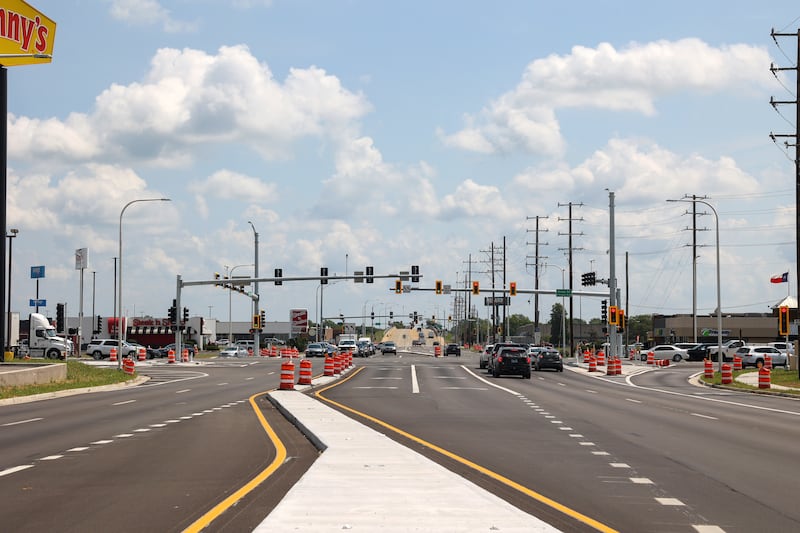 Motorists travel through the intersection at Armour Road and Bradley Boulevard (Illinois Route 50) in Bourbonnais Township on Tuesday, Aug. 12, 2025, as the Illinois Department of Transportation officially celebrated the completion of the $13.8-million project. Designated turn lanes were added along with road widening and repaving at the the most heavily used intersection within Kankakee County.