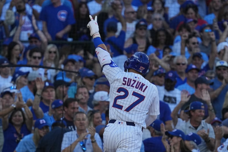 Chicago Cubs' Seiya Suzuki, of Japan, celebrates after hitting a home run during the fifth inning of Game 1 of a National League wild card baseball game against the San Diego Padres Tuesday, Sept. 30, 2025, in Chicago. (AP Photo/Nam Huh)