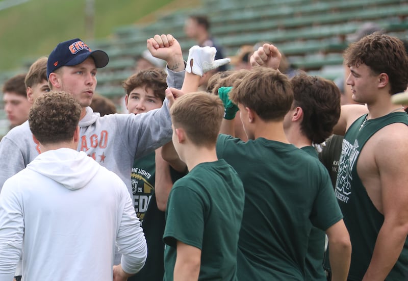 Chicago Bears quarterback Tyson Bagent breaks a huddle with high school students during the Tyson Bagent Offensive Skills Camp on Saturday, May 23, 2026 at St Bede Academy.
