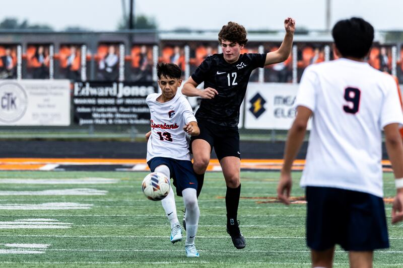 Romeoville's Luiz Arazate and Minooka's Kameron Kapellas fight for control of the ball during a varsity soccer game at Minooka on Sept. 23, 2025.