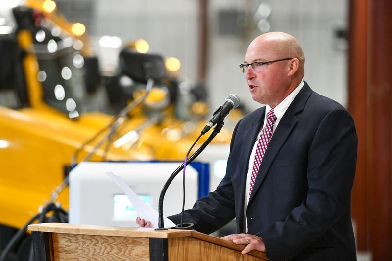 Herscher School District Superintendent Rich Decman addressed the audience gathered during the October opening of the school district's maintenance facility for its electric bus fleet. The district has the largest fleet of EV buses in Illinois, purchased through now-troubled Lion Electric.