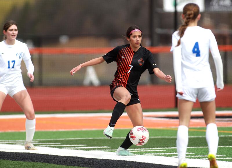 St. Charles East’s Mya Leon (center) gets control of the ball during a game on Tuesday, April 1, 2025 against Burlington Central in St. Charles.