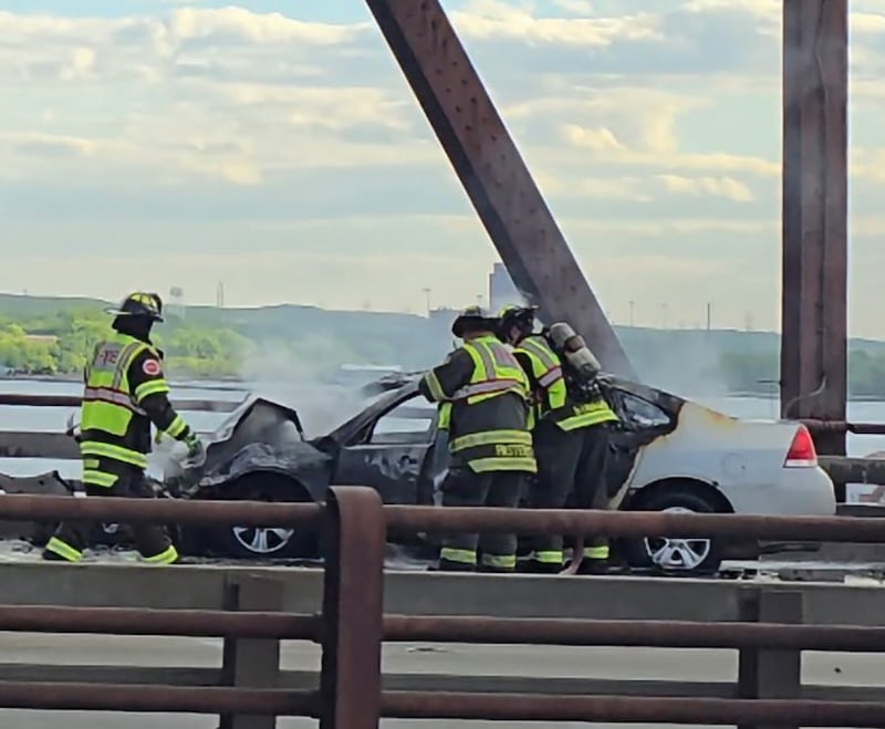 Firefighters at the scene of a crash on Wednesday, May 13, 2026, at the Interstate 80 bridge in Joliet.