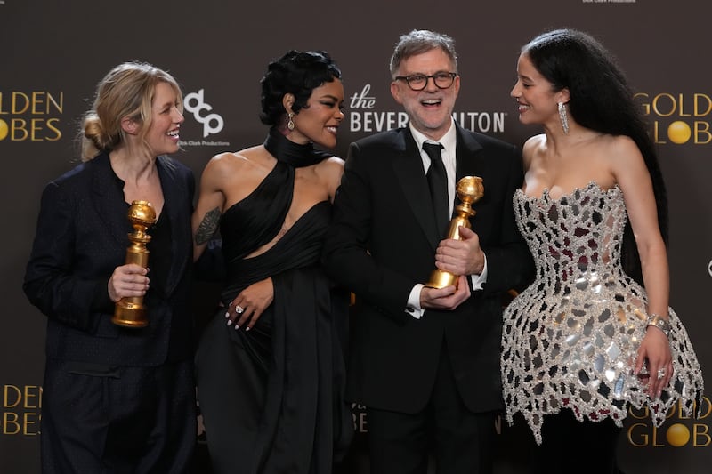 Sara Murphy, from left, Teyana Taylor, Paul Thomas Anderson, and Chase Infiniti pose in the press room with the award for best motion picture – musical or comedy for "One Battle After Another" during the 83rd Golden Globes on Sunday, Jan. 11, 2026, at the Beverly Hilton in Beverly Hills, Calif. (AP Photo/Chris Pizzello)