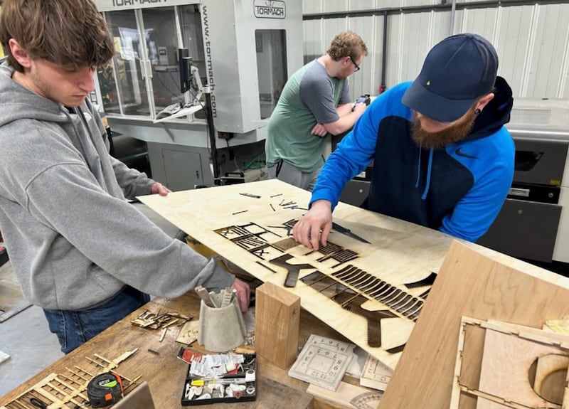 Hunter Milam (left), Shawn Wherry (right) and Wyatt Brame (background) work in the Innovation Center at Morrison Institute of Technology. Morrison Tech is one of two Whiteside County businesses currently in the running for the 2025 Chicago Innovation Awards, and People’s Choice Award. Voting is open through Oct. 9.