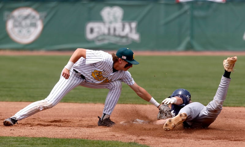 Crystal Lake South's Carson Trivellini tags out Cary-Grove's Peyton Seaburg at second base during the IHSA Class 3A Grayslake Central Sectional Championship baseball game on Saturday, June 7, 2025, at Grayslake Central High School.