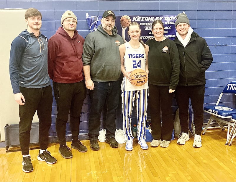 Princeton senior Keighley Davis set the program scoring record at 1,509 points, eclipsing the 27-year record held by Tiah Romagnoli. She's joined by her parents, Spencer and Annette, and brothers Teegan (from left), Wyatt and Drake.