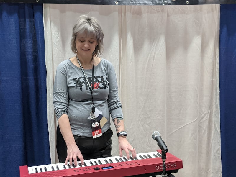 School of Rock owner/manager Becky Adamitis plays the keyboard at her booth at the Oswego Area Chamber of Commerce Hometown Expo at Oswego High School on Saturday, Feb. 28, 2026.