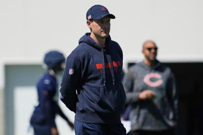Chicago Bears new head coach Ben Johnson watches players during the NFL football team's rookie camp in Lake Forest, Ill., Friday, May 9, 2025. (AP Photo/Nam Y. Huh)