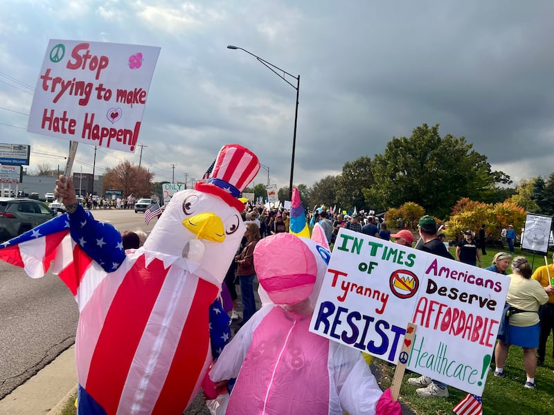 Hundreds rallied at the 'No Kings' movement in DeKalb on Oct. 18, 2025. Several inflatable costumes mirrored those worn by people confronting ICE in Portland, Oregon.