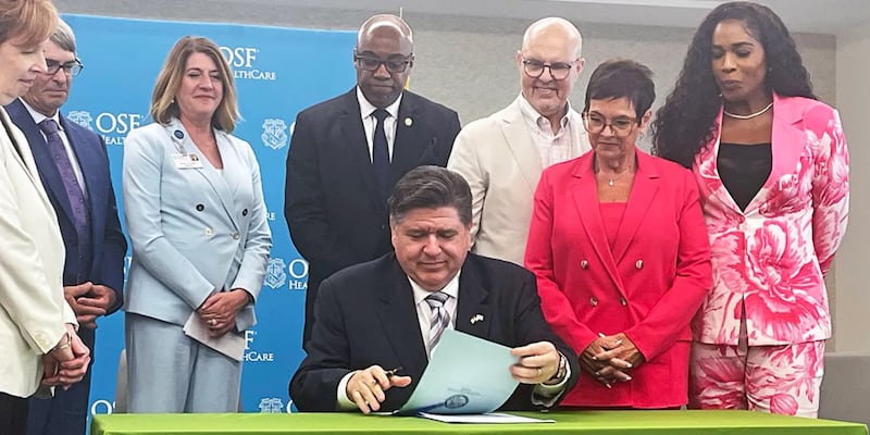Gov. JB Pritzker signs two bills related to health care costs at a hospital in Peoria, including a bill that puts more controls on pharmacy benefit managers.