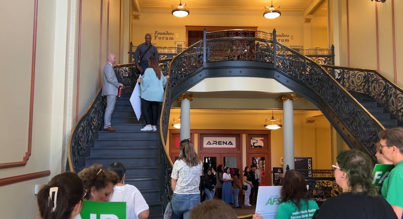 With a campus tour passing by on the first floor of Altgeld Hall on Sept. 16, 2025, the president of AFSCME Local 1890, Rave Meyer, was told by NIU officials Bryan Perry and John Acardo that she and others would have to wait if they wanted to have face time with NIU president Lisa Freeman.