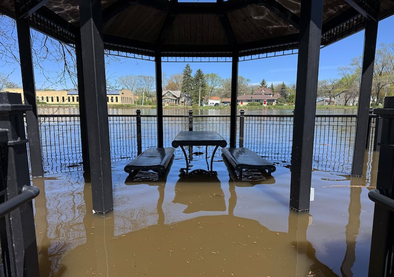 A gazebo and picnic table along the Fox River in West Dundee are flooded on Monday, Apr. 20, 2026.