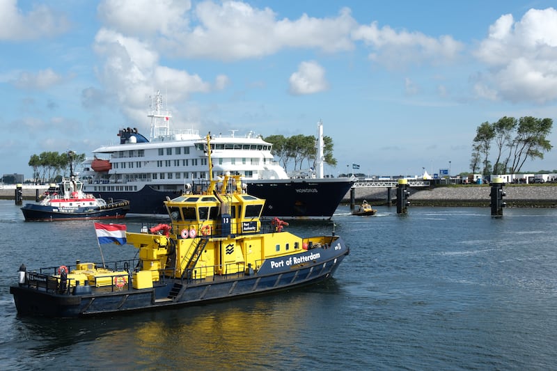 The MV Hondius cruise ship, center, arrives at the Port of Rotterdam, Netherlands, Monday, May 18, 2026. (AP Photo/Patrick Post)