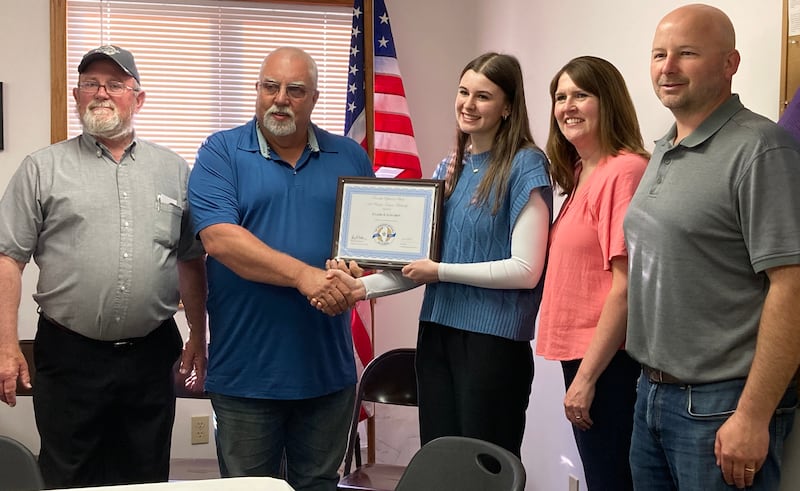 (Left to right); LaMoille Township supervisor David Weeks, Township Officials of Illinois Association treasurer Arnold Vegter, scholarship recipient Claire Lovgren, Robin Lovgren, and LaMoille Township clerk Eric Lovgren