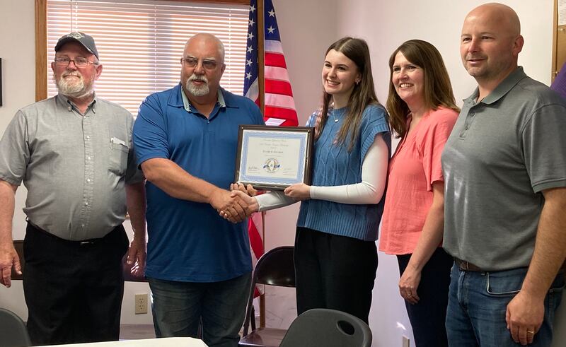 (Left to right); LaMoille Township supervisor David Weeks, Township Officials of Illinois Association treasurer Arnold Vegter, scholarship recipient Claire Lovgren, Robin Lovgren, and LaMoille Township clerk Eric Lovgren