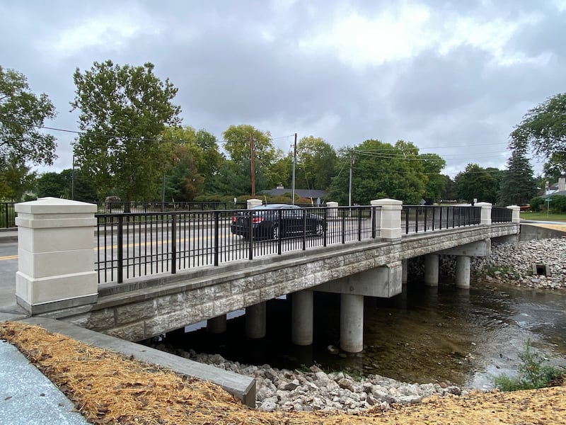 A car travels across the Lucinda Avenue bridge near Northern Illinois University campus in DeKalb on a rainy Sunday afternoon, Sept. 22, 2024. The traffic detour also has been lifted.
