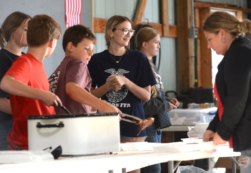 Oregon FFA members will serve pork chops at the Mt. Morris - Oregon FFA Alumni Dinner and Auction on Saturday, June 14 at the Ogle County Fairgrounds.