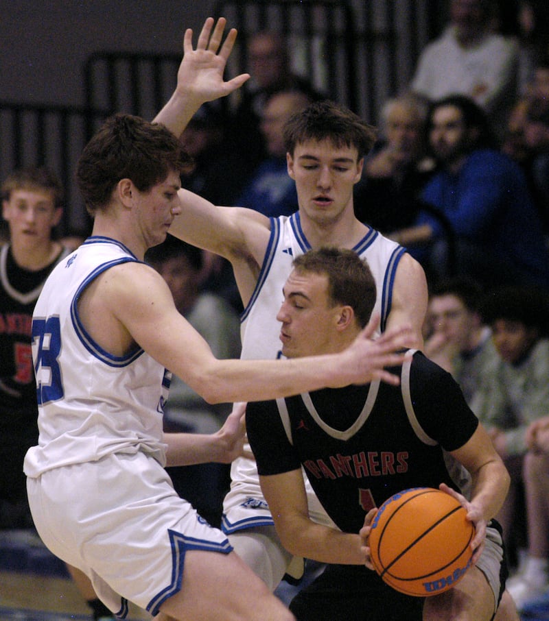 Erie-Prophetstown Keegan Winckler deals with Newman's defense. The Newman Comets hosted the Erie-Prophetstown Panthers in a Conference game. The game was played at Newman High School on February 6, 2026.