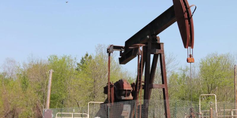 An oil well pumpjack is pictured