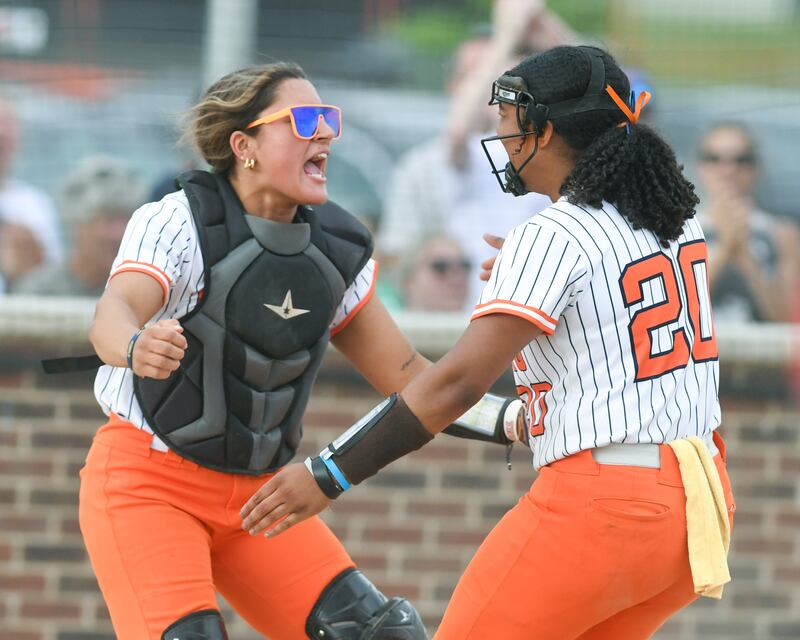 Oswego teammates Kiyah Chavez, left, and Jaelynn Anthony hug after taking a win over Yorkville on Tuesday June 3, 2025, during the sectional semifinal game held at Oswego High School.