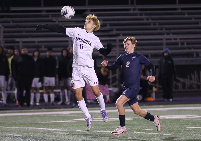 Mendota's Danny Garcia gets in front of Quincy Notre Dame's Matthew Many to knock down the ball during the Class 1A Supersectional game on Monday, Nov. 3, 2025 at Mendota High School.