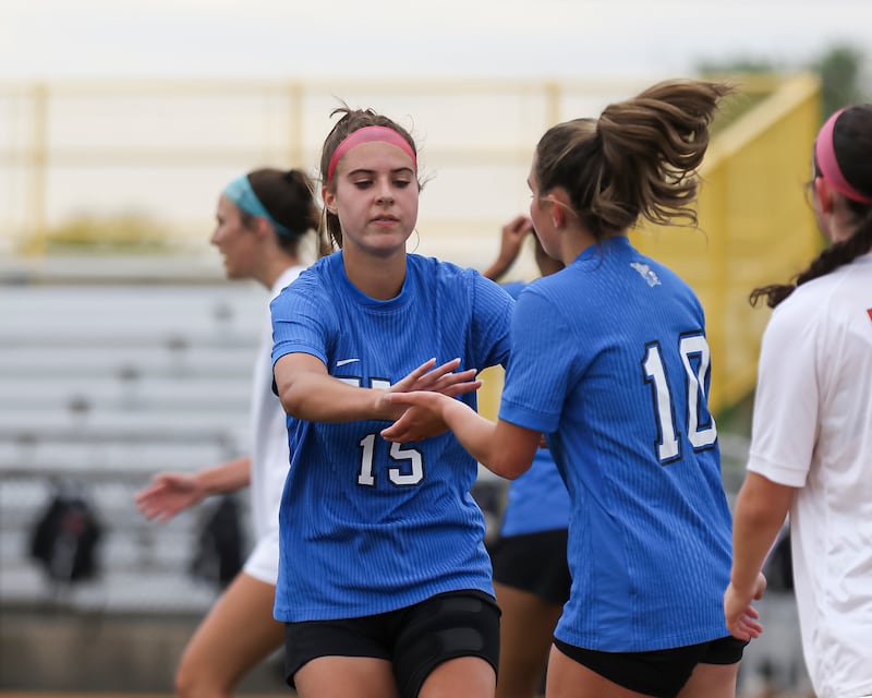 Lincoln-Way East's Ellie Feigl (15) celebrates her goal with Maddie Strzechowski (10) during the Class 3A Joliet West Sectional semi-final soccer match between Lincoln-Way West at Lincoln-Way East.  May 27, 2025.