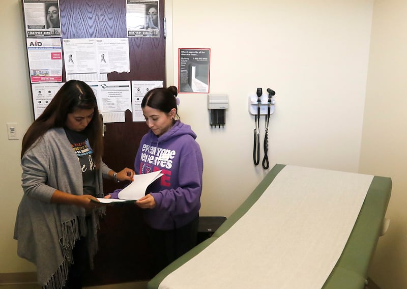 Jaret Ross, a social worker with Family Health Partnership Clinic, talks with nurse Nancy Estrada on Thursday afternoon, Sept. 28, 2023, at the Crystal Lake clinic. Social services agencies like the Family Health Partnership Clinic asking the county for more money for mental health treatment as part of the county's 2024 budget.