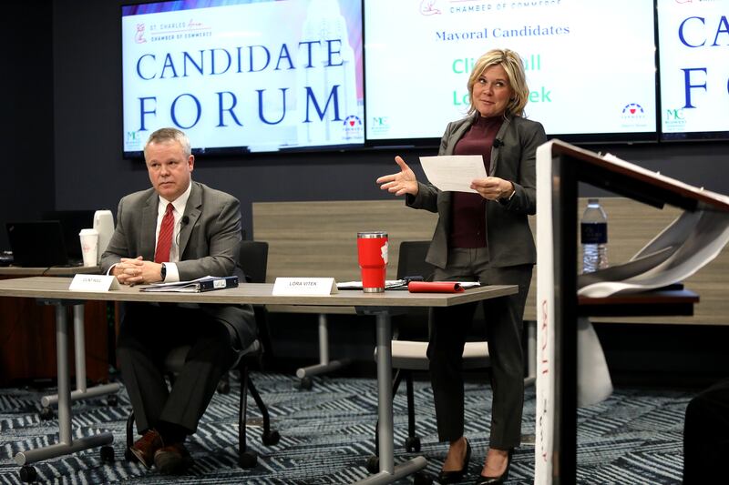 St. Charles incumbent mayor Lora Vitek answers a question as challenger Clint Hull looks on during a candidate forum hosted by the St. Charles Area Chamber of Commerce on Thursday, March 6, 2025 at the Realtor Association of the Fox Valley in St. Charles.