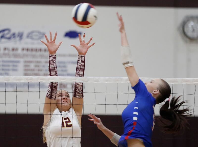 Richmond-Burton's Zoe Freund tries to block the spike of Lakes’ Addison Sundquist during a nonconference volleyball match on Monday, Sept. 29, 2025, at the Richmond-Burton High School in Richmond.