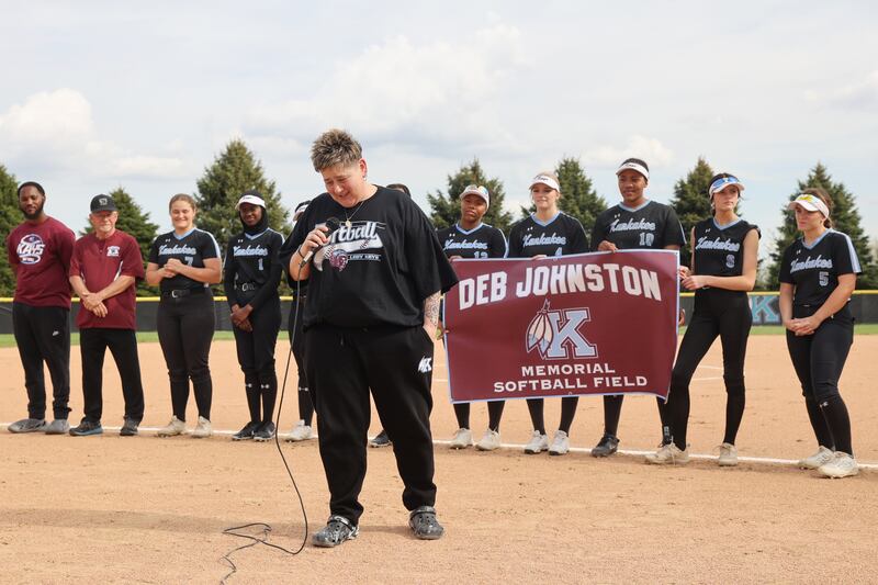 Gina Turro, who coached with the late Deb Johnston, recalls memories and stories about the impact "Coach J" had on the district during a pregame ceremony dedicating the Deb Johnston Memorial Softball Field at Kankakee High School on Wednesday, May 7, 2025.