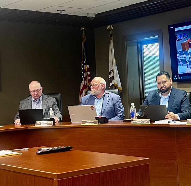 Sterling City Attorney Tim Zollinger and Aldermen at Large Jim Wise and Allen Przysucha listen to the Sterling Police Department's annual report during a City Council meeting on May 5, 2025.