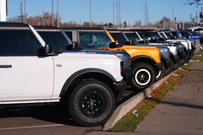 A long line of unsold 2024 Bronco utility vehicles sit on display at Ford dealership in southeast Denver.