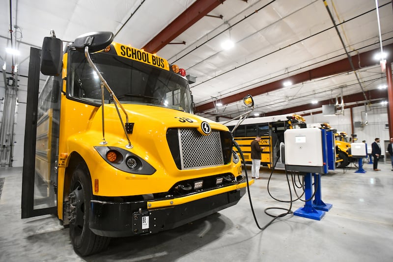 Attendees tour the new bus garage at Herscher High School during an open garage event on Oct. 7, 2024. The Herscher School District implemented 25 new electric buses this year through a U.S. Environmental Protection Agency grant of nearly $10 million.