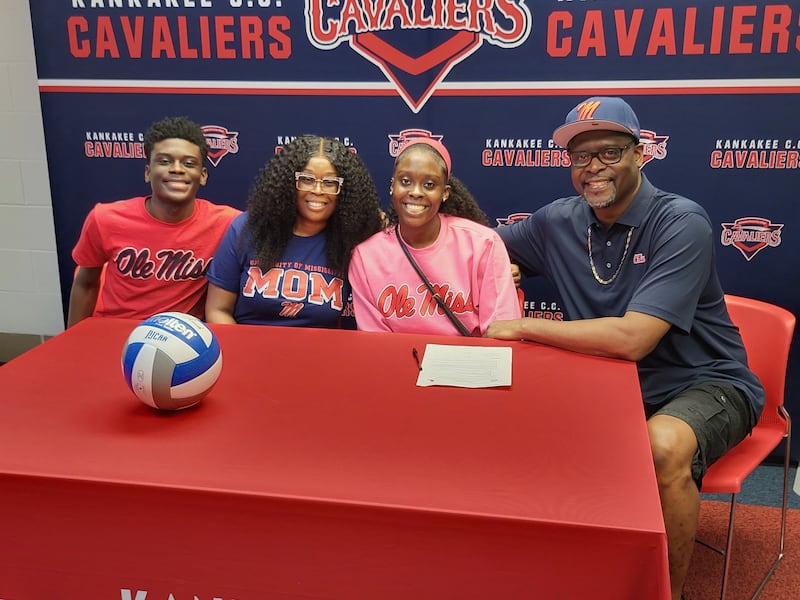 Kankakee Community College's Aniya Lewis (second from right), her brother Anthony Lewis Jr. (left), mother Natasha Lewis and father Anthony Lewis Sr. pose for a photo after Aniya's commitment ceremony at KCC on July 1, 2025.