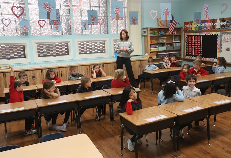 Mrs. Katie Henkel, teaches her kindergarten class on Thursday, Feb. 5, 2026 at Holy Cross Elementary School in Mendota. Henkel recently did a "name that kindergartener trend through the school's Facebook page. It has generated over 22,000 views.