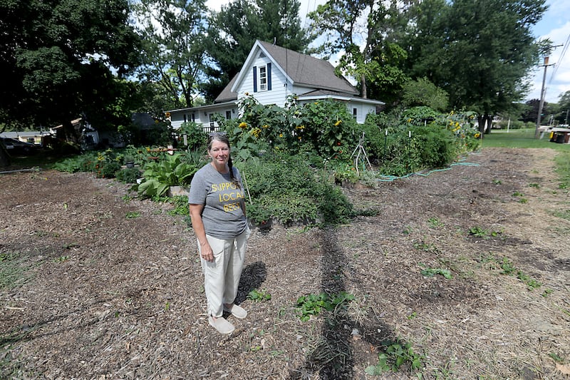 Konni Vukelic, the owner of Three Bees Honey Farms, is upset with the way the City of Marengo handled removing part of her pollinator garden around her home in Marengo.