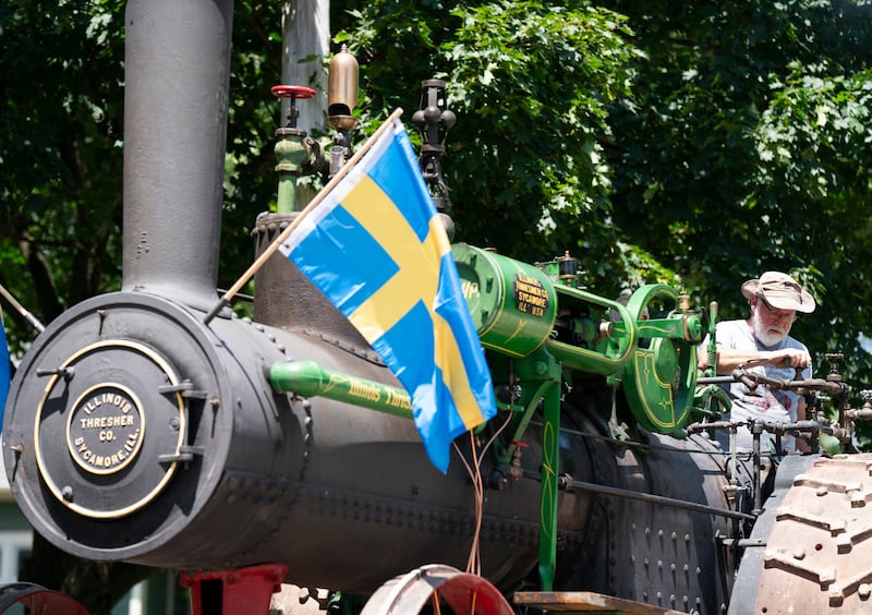 Mike Luse, of Belvidere, with the Northern Illinois Steam Power Club, operates an Illinois Steam Engine Thresher built in Sycamore in 1916, during the 75th annual Swedish Days parade on Sunday, June 22, 2025 in downtown Geneva. The event, sponsored by the Geneva Chamber of Commerce, was the final event of the festival that ran June 18th-22th.