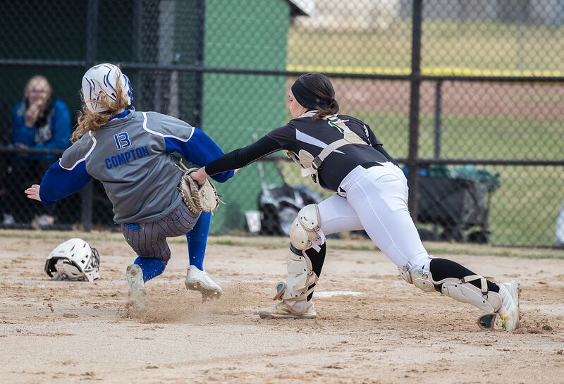 Princeton’s Taylor Compton is tagged out at home by Rock Falls’ Maddison Morgan Thursday, March 27, 2025.