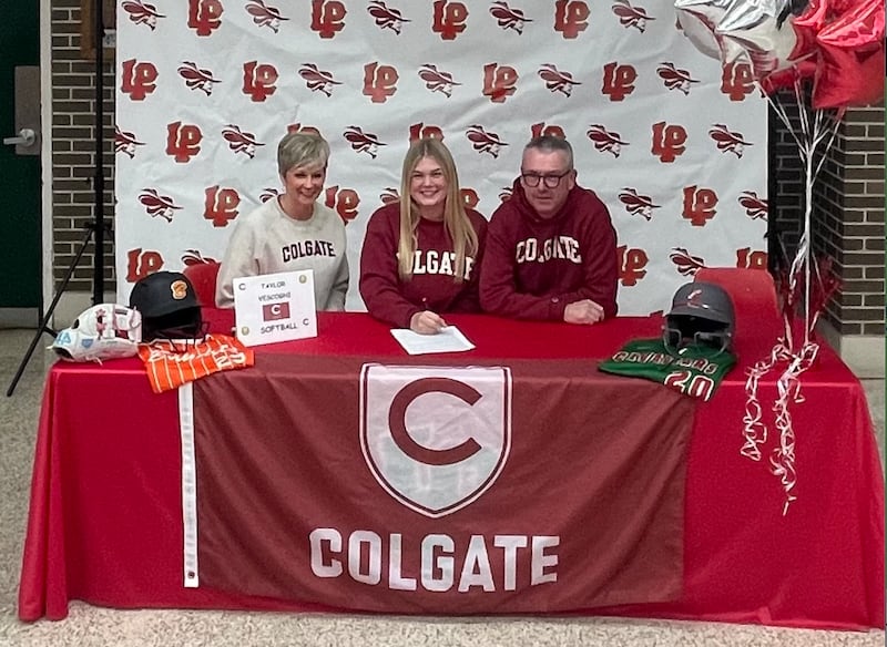 La Salle-Peru senior Taylor Vescogni (center) signed to play softball at Colgate University. She was joined by her parents, Shelly and Brian.