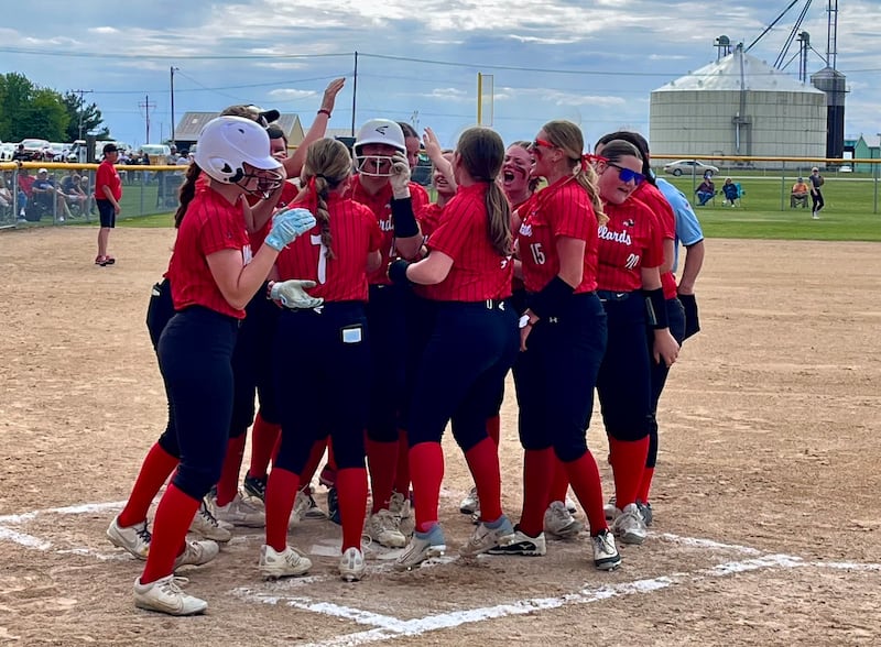 Henry-Senachwine senior Kaitlyn Anderson is greeted at home plate by her teammates after hitting a solo home run in the first inning of the Mallards' 8-4 victory over Ridgewood in a Class 1A AlWood Sectional semifinal on Tuesday, May 27, 2025 in Alpha.