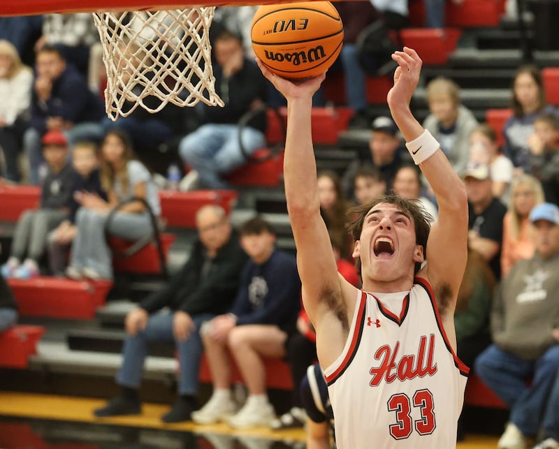 Hall's Braden Curran runs in for a layup against Fieldcrest during the Colmone Classic on Friday, Dec. 12, 2025 at Hall High School.