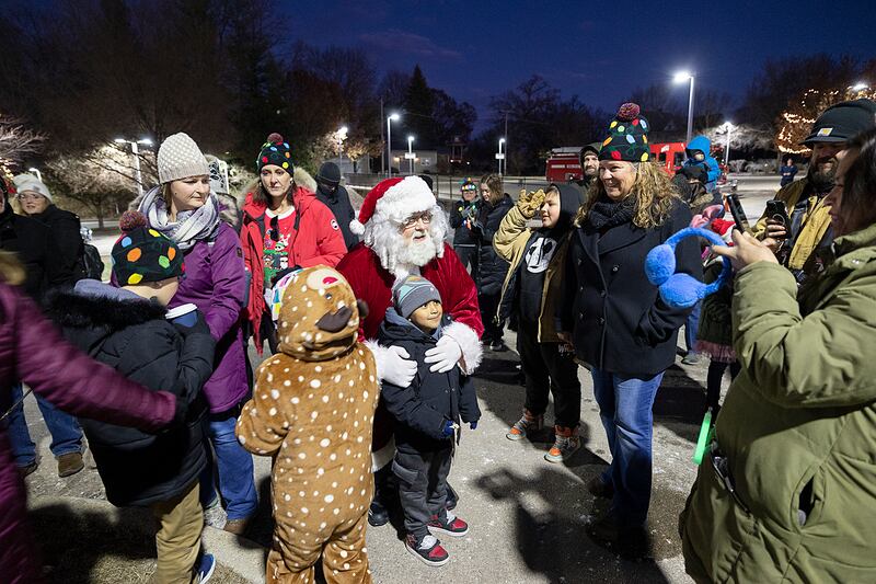 Santa stops to visit youngsters at the tree lighting for Dixon’s Christmas Walk Friday, Dec. 6, 2024.