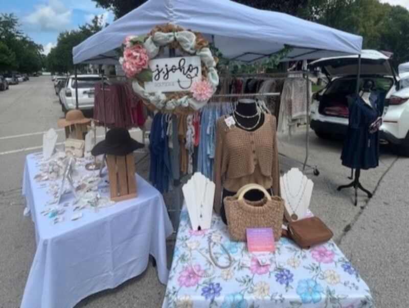 A stand at the Minooka Vintage Faire selling clothing and jewelry.