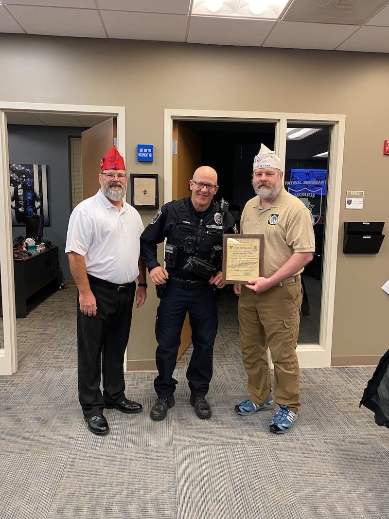 From left to right: Steve Huettemann of the 40&8, Officer Scott Evans, and Robert Dettman of the 40&8.