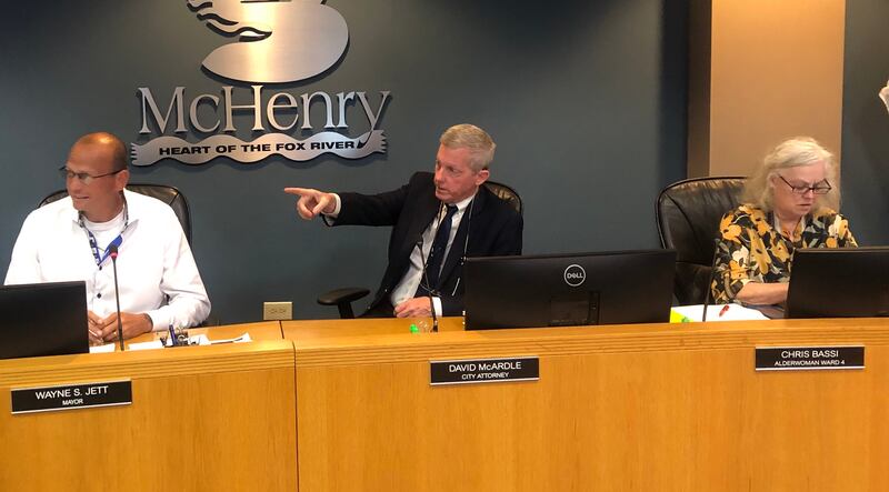 McHenry Mayor Wayne Jett, left, will face off against 4th Ward Alderwoman Chris Bassi, right, who is also running for mayor in the April 1, 2025, elections. The two sit on either side of City Attorney David McArdle during the Sept. 16, 2024, city council meeting.