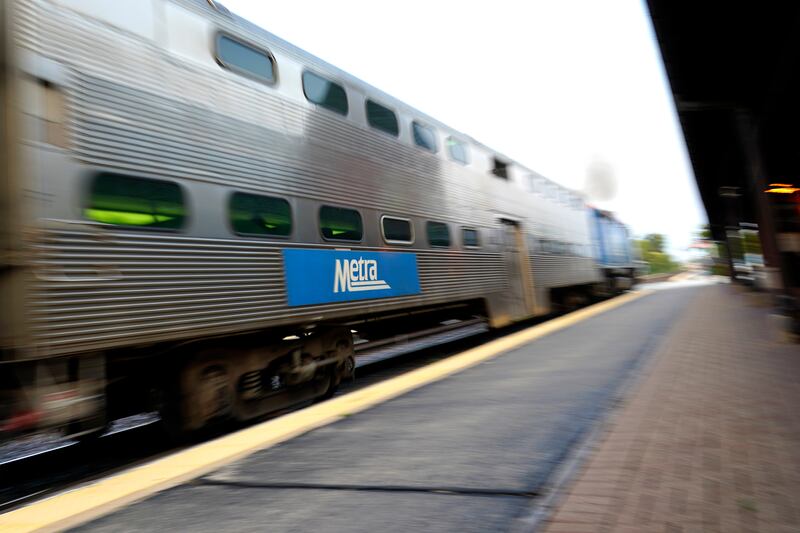 A Metra train leaves at the Metra Arlington Heights station, Thursday, Sept. 15, 2022, in Arlington Heights, Ill. (AP Photo/Nam Y. Huh)
