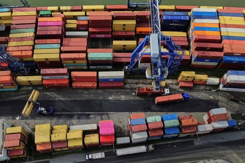 Containers are piled up in a cargo terminal in Frankfurt, Germany, Friday, Aug. 1, 2025. (AP Photo/Michael Probst)